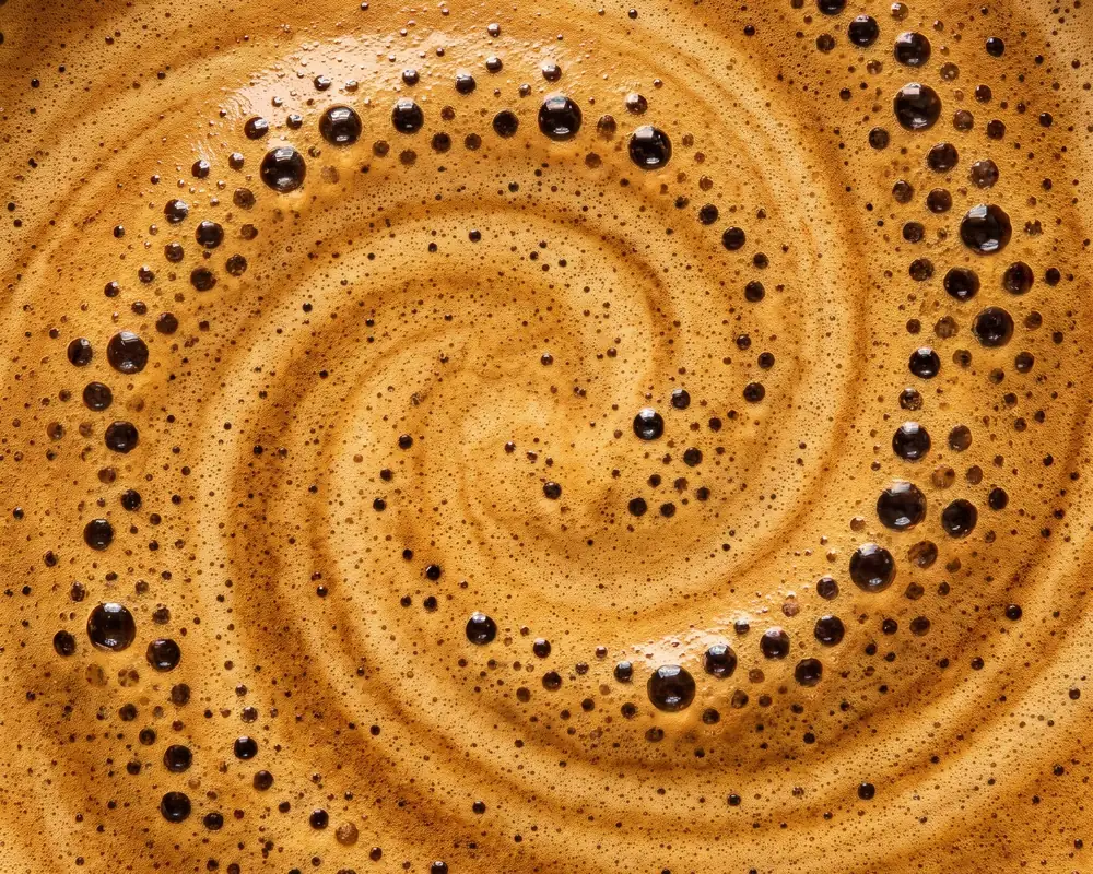 Milk swirling in coffee crema